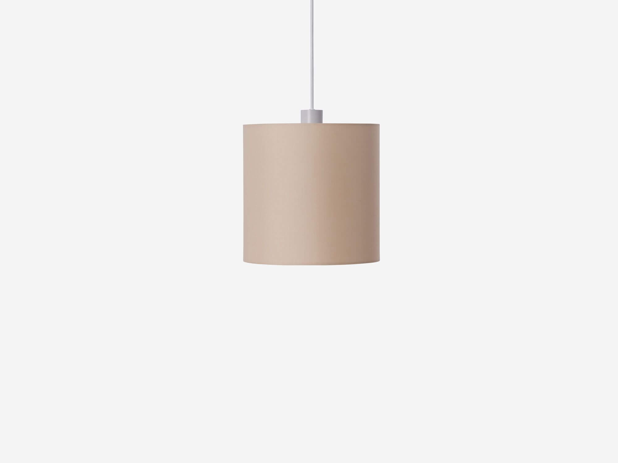 Side view of beige pendant shade with light off